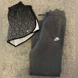 grey sweats paired with black and white shorts